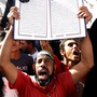 A protester holds a Quran at a Salafi rally for the enforcement of Islamic Shariah law last fall in Cairo's Tahrir Square. Repressed during the rule of President Hosni Mubarak, the country's ultra-conservative Salafis have seen a resurgence since the Arab Spring uprising. A protester holds a Quran at a Salafi rally for the enforcement of Islamic Shariah law last fall in Cairo's Tahrir Square. Repressed during the rule of President Hosni Mubarak, the country's ultra-conservative Salafis have seen a resurgence since the Arab Spring uprising.