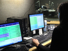 NPR Editorial Assistant Laura Lee takes and screens calls during a live broadcast of Talk of the Nation. Look just above Lee's head to see Neal Conan in the hosting chair on the other side of the glass. NPR Editorial Assistant Laura Lee takes and screens calls during a live broadcast of Talk of the Nation. Look just above Lee's head to see Neal Conan in the hosting chair on the other side of the glass.