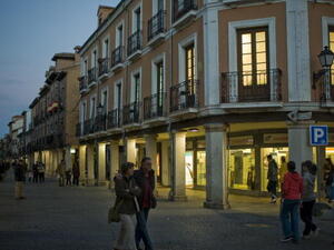 The Catholic Church owns more than just places of worship. It also owns apartments and retail buildings. Here, arcades line the busy Calle Mayor (Main Street) in Alcala de Henares, Spain, in 2008.