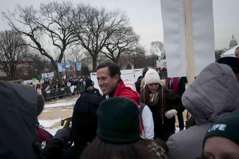 Former GOP presidential contender Rick Santorum greets participants after speaking to a crowd of anti-abortion activists during today's March for Life rally.