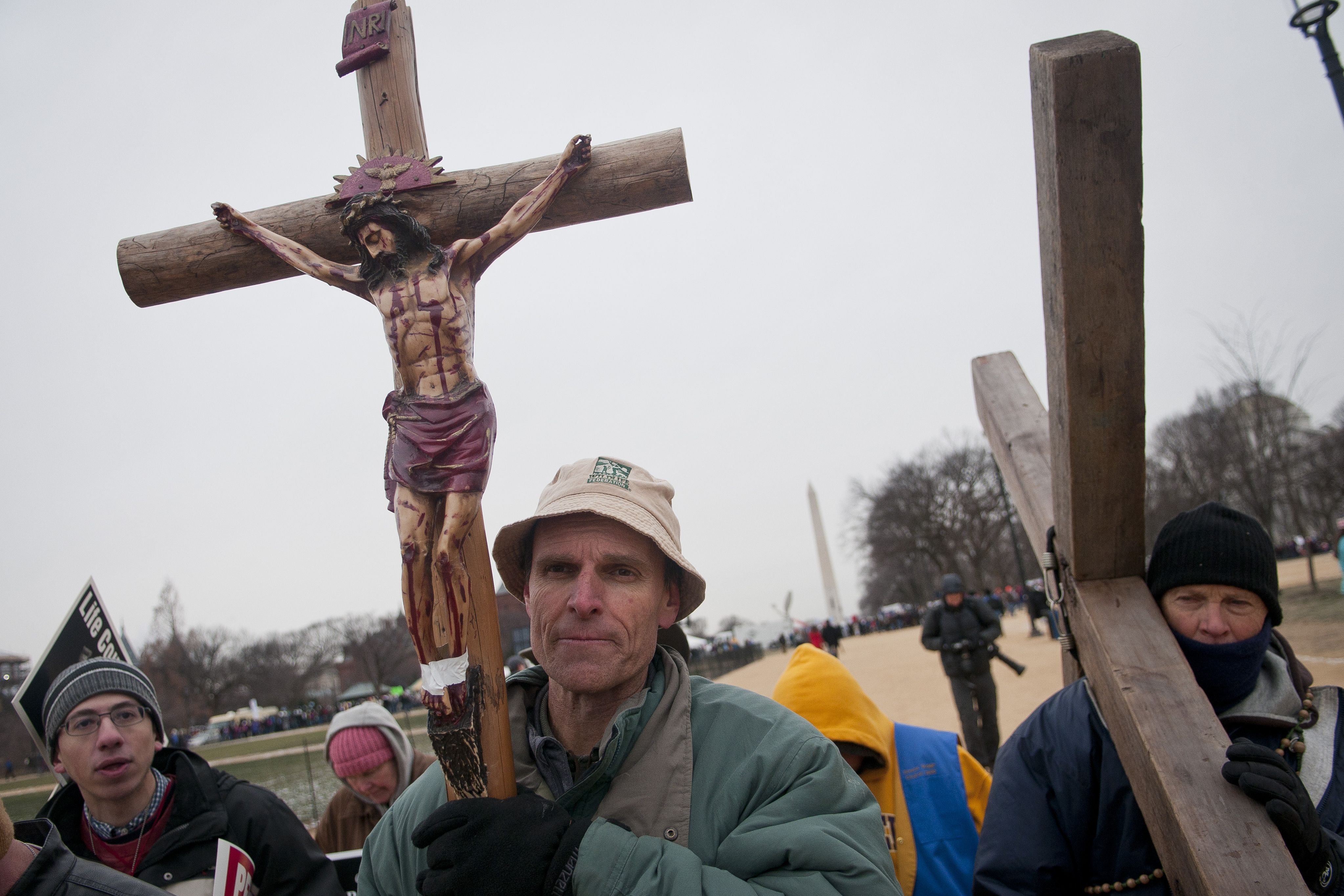 Louisiana residents and members of Soliders for Christ under Our Lady of Guadalupe, carried crosses and recited the 