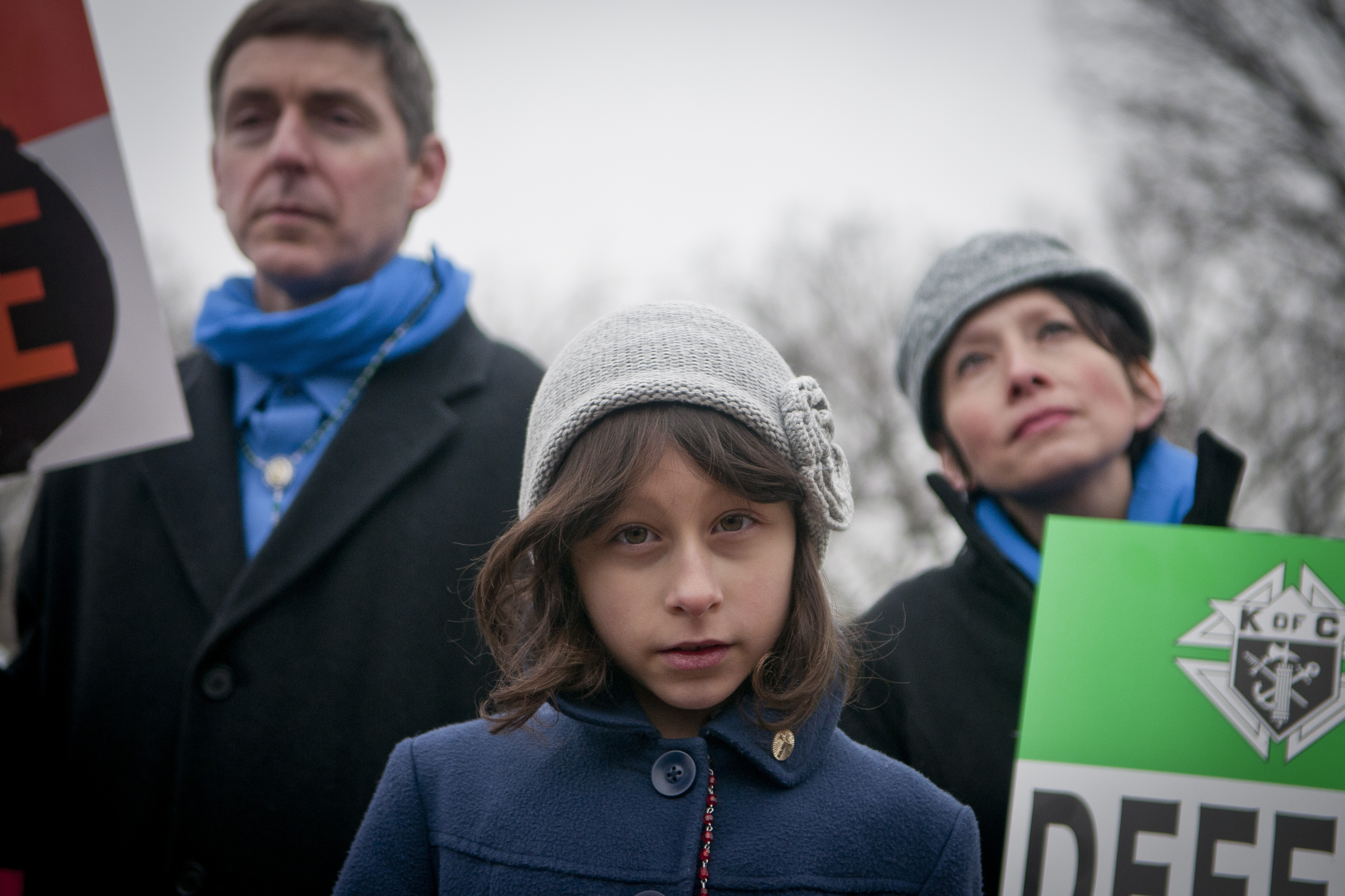 Lucia Dragas, 8, from Boston, Mass., held a poster saying 