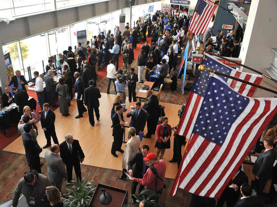 Hundreds of veterans and military spouses meet with prospective employers at the Hiring Our Heroes job fair at Nationals Park in Washington, D.C., in December. Veterans say they're still having trouble finding jobs and getting other types of assistance.
