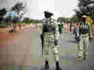 Malian soldiers man a checkpoint on the Gao road outside Sevare, some 385 miles north of Mali's capital, Bamako, on Sunday.