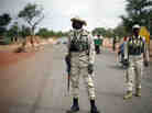 Malian soldiers man a checkpoint on the Gao road outside Sevare, some 385 miles north of Mali's capital, Bamako, on Sunday.