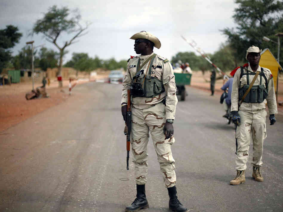 Malian soldiers man a checkpoint on the Gao road outside Sevare, some 385 miles north of Mali's capital, Bamako, on Sunday.