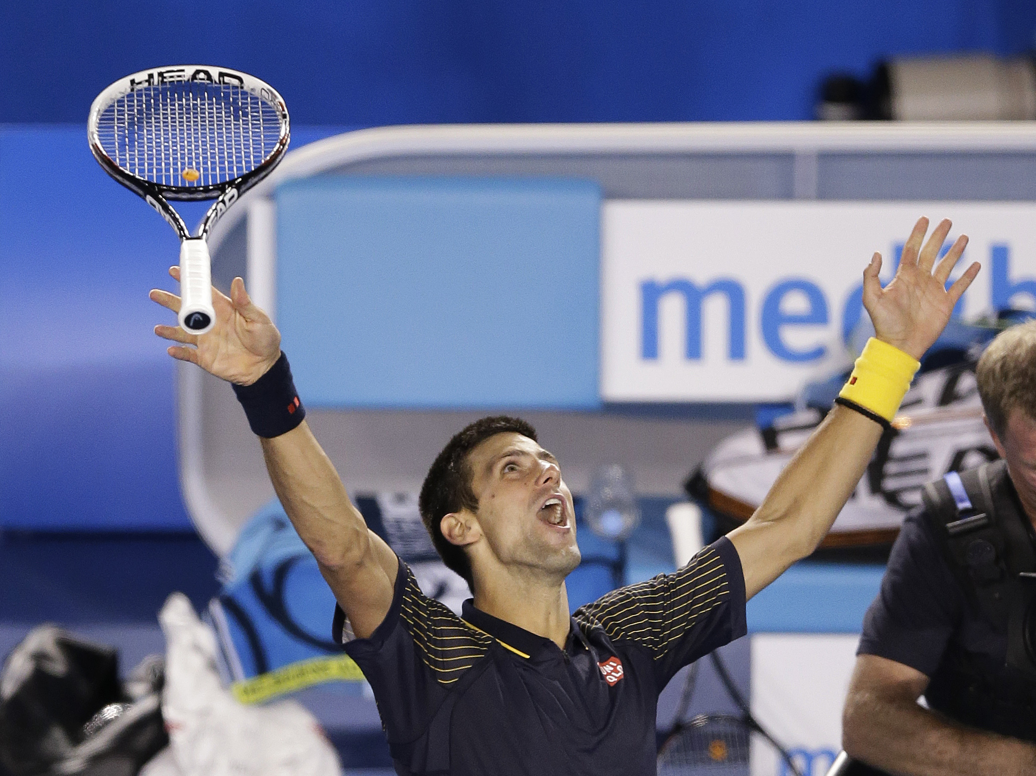 Serbia's Novak Djokovic tosses his racquet as he celebrates his win over Britain's Andy Murray in the men's final at the Australian Open tennis championship in Melbourne, Australia, on Sunday. Serbia's Novak Djokovic tosses his racquet as he celebrates his win over Britain's Andy Murray in the men's final at the Australian Open tennis championship in Melbourne, Australia, on Sunday.