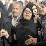 Relatives of the Egyptian policemen who were killed in Port Said grieve during their military funeral in Cairo on Sunday.