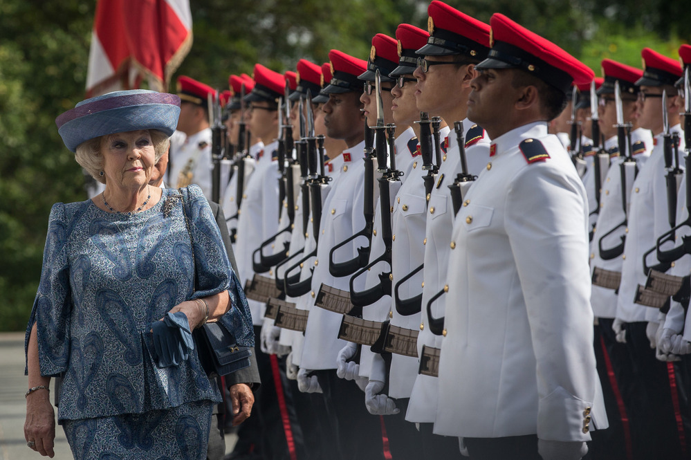 Queen Beatrix of the Netherlands inspects the honor guard with Singapore President Tony Tan at the Istana in January.
