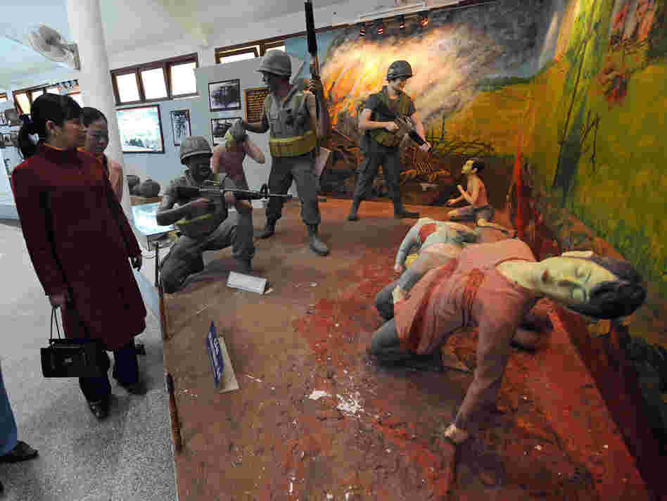 Visitors take in a re-created scene at the massacre museum at Vietnam's My Lai village. Researcher Nick Turse says atrocities of all kinds were more common in the Vietnam War than most Americans believe.