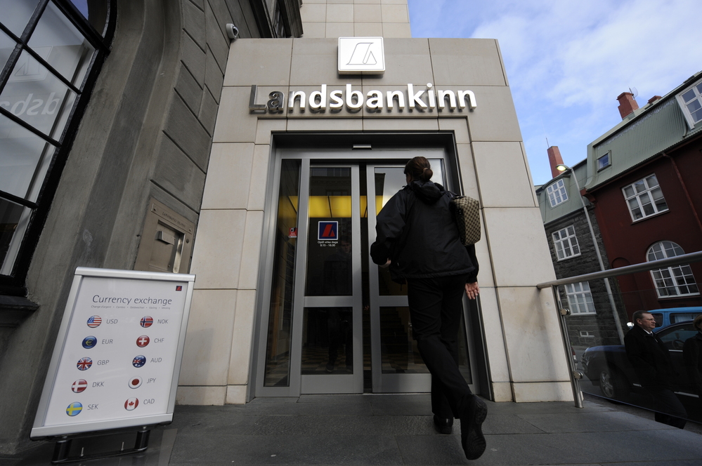 A file picture shows a woman entering a branch of Iceland's second largest bank, Landsbanki (Landsbankinn) on October 8, 2008 in Rejkjavik.