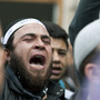 A demonstrator shouts anti-government slogans as he stands in front of the Justice Ministry in the Tunisian capital, Tunis, on Nov. 6, 2012, as part of a demonstration by radical Salafi Muslims protesting against the imprisonment of hundreds of Salafist militants.