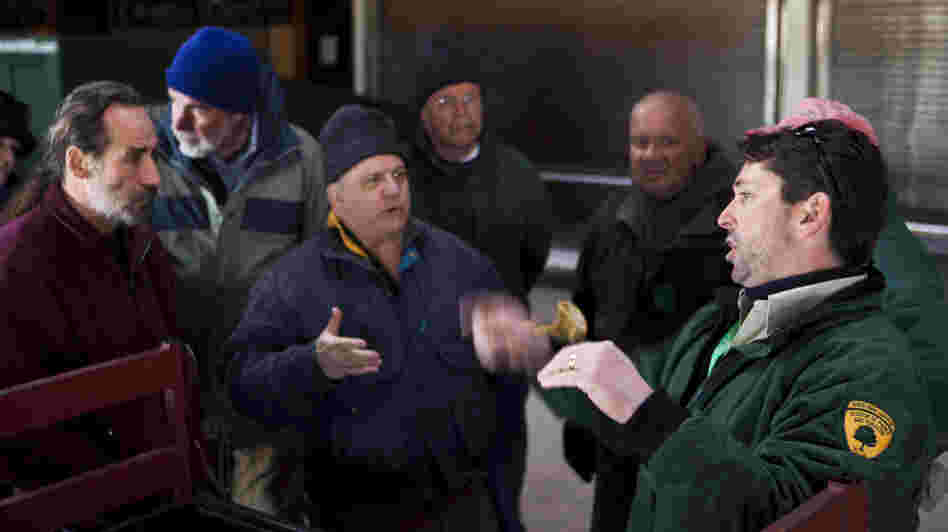Ray Bukowski (far right), manager of Island Beach State Park, organizes members of the New Jersey Beach Buggy Association.
