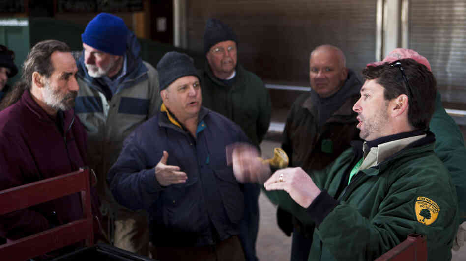 Ray Bukowski (far right), manager of Island Beach State Park, organizes members of the New Jersey Beach Buggy Association.