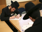Ultra-Orthodox Jews are not required to perform military service in Israel, and the issue is subject to intense debate following the country's election last week. Here, ultra-Orthodox men sign up for alternate civilian service earlier this month. Ultra-Orthodox Jews are not required to perform military service in Israel, and the issue is subject to intense debate following the country's election last week. Here, ultra-Orthodox men sign up for alternate civilian service earlier this month.