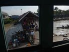 Food vendors wait for customers at a ferry pier in Yangon on January 28. Food vendors wait for customers at a ferry pier in Yangon on January 28.