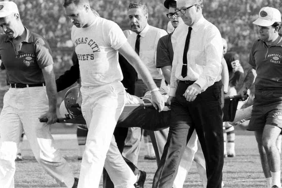 Kansas City's injured Fred "The Hammer" Williamson is carried off the field.