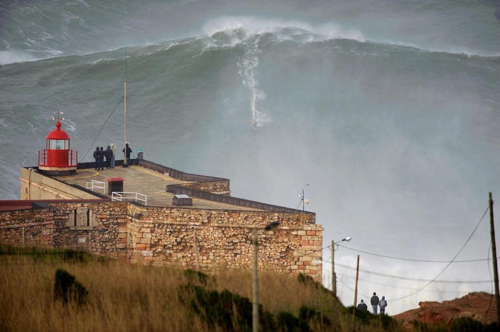 Garrett McNamara surfs a huge wave in Nararé, Portugal.