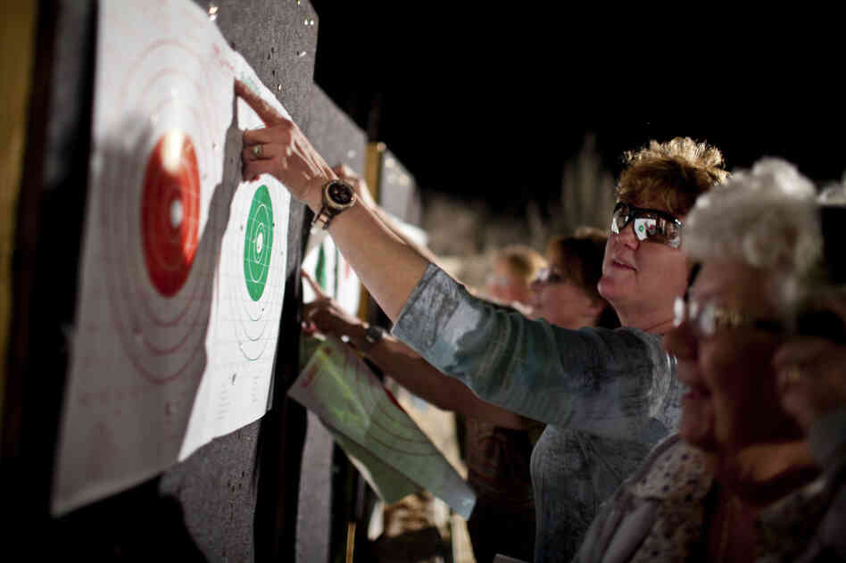 Delores Mouton looks at her target with her daughter Paulette Boudreaux. Mouton says her daughter encouraged her to come to the event.