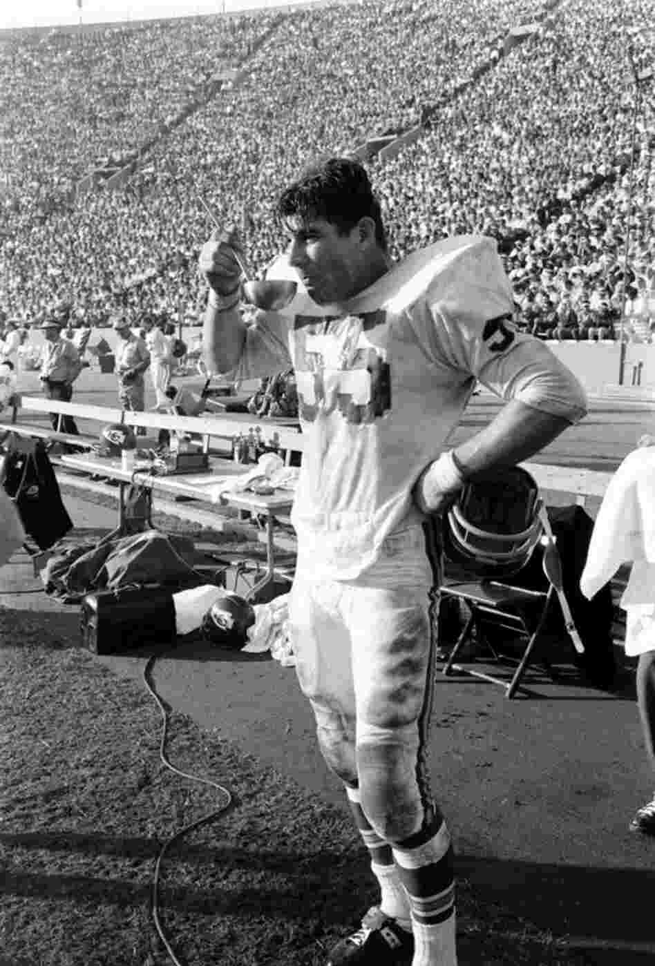 Chiefs linebacker E.J. Holub, drinking from what looks to be a ladle.