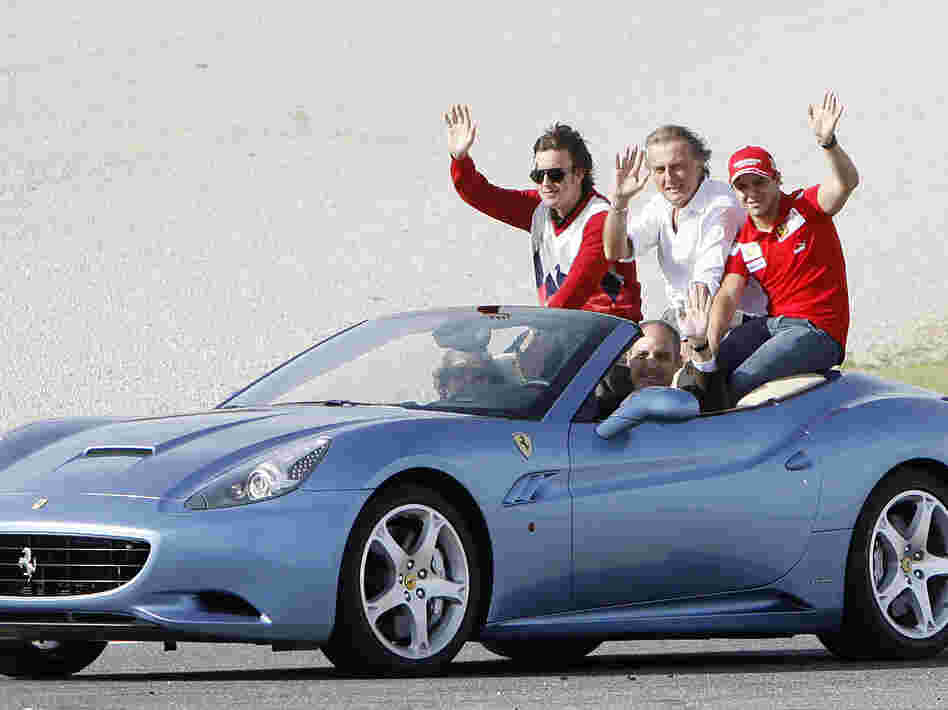 In 2009, Formula One driver Fernando Alonso (from left), Ferrari President Luca Cordero di Montezemolo and Ferrari F1 driver Felipe Massa ride in a Ferrari driven by Valencia's then-regional government president Francisco Camps.