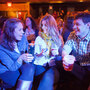 Ask Me Another audience members enjoy some potent potables from The Bell House's esteemed bartenders.