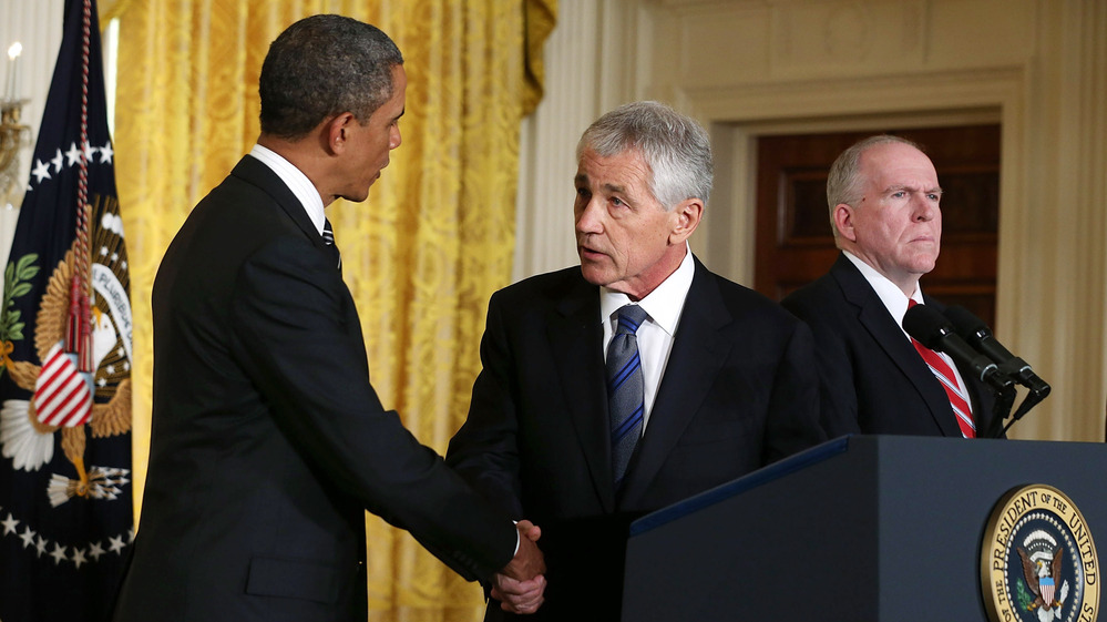 President Obama shakes hands with his nominee to head the Defense Department, former Sen. Chuck Hagel, at the White House on Jan. 7. John Brennan, Obama's choice for director of the CIA, looks on.