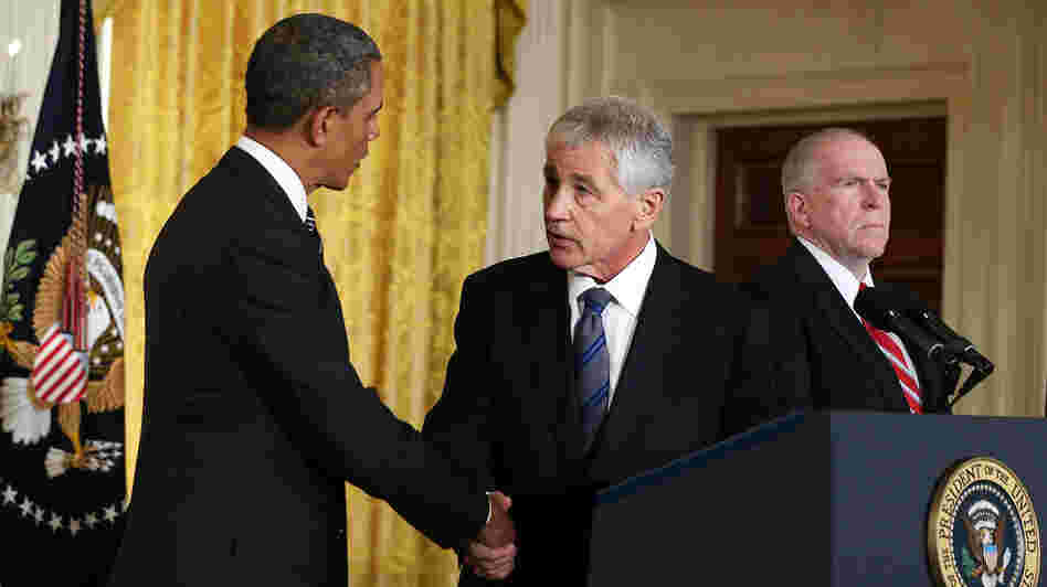 President Obama shakes hands with his nominee to head the Defense Department, former Sen. Chuck Hagel, at the White House on Jan. 7. John Brennan, Obama's choice for director of the CIA, looks on.