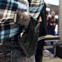 A concealed handgun permit holder waits to enter the General Assembly building in Richmond, Va., on Jan. 21. Known as "gun lobby day," crowds of gun owners visited the capital to argue in favor of gun rights. Most states in the U.S. allow people to openly carry guns in certain public places.