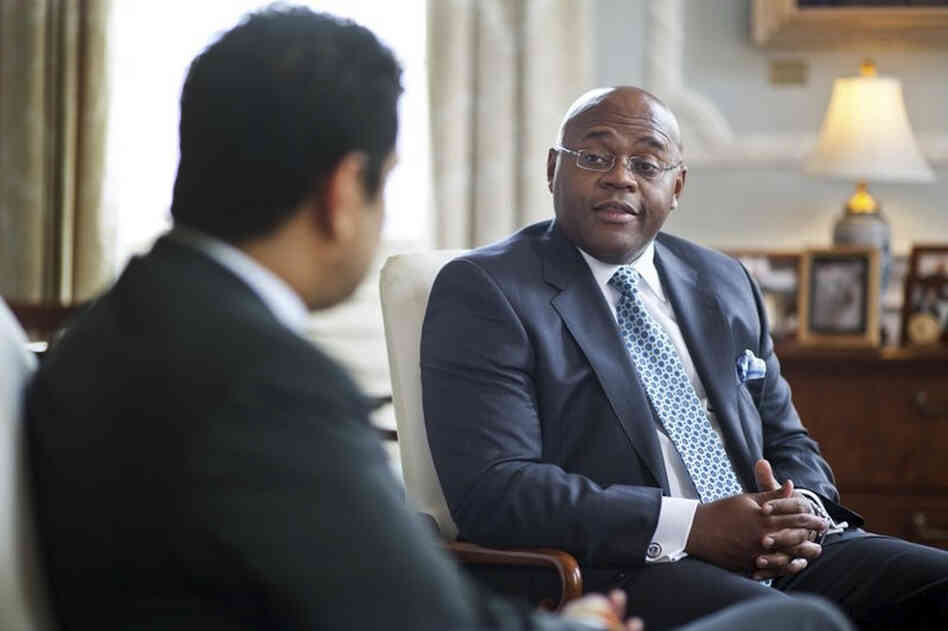 This undated photo released by the Massachusetts Governor's office shows William "Mo" Cowan, right, former chief of staff for Gov. Deval Patrick.