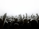 A crowd waving its hands. A crowd waving its hands.
