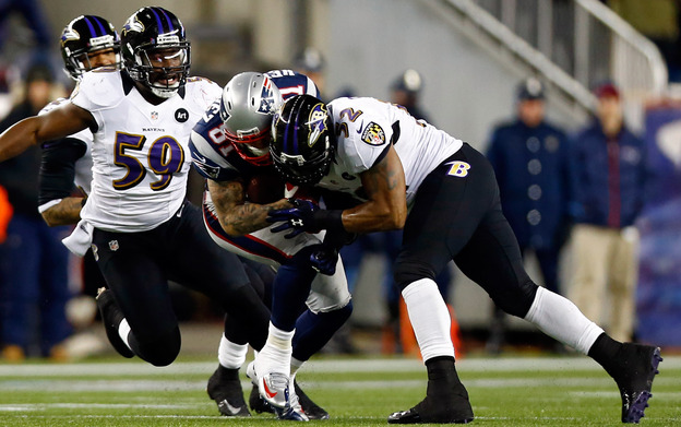 Baltimore Ravens Ray Lewis tackles New England Patriots Aaron Hernandez with his helmet during the 2013 AFC Championship game this year.