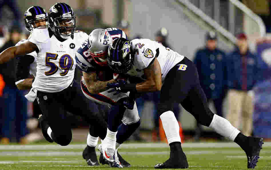 Baltimore Ravens Ray Lewis tackles New England Patriots Aaron Hernandez with his helmet during the 2013 AFC Championship game this year.