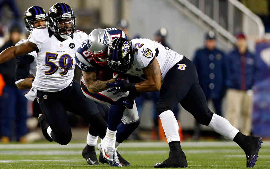 Baltimore Ravens Ray Lewis tackles New England Patriots Aaron Hernandez with his helmet during the 2013 AFC Championship game this year.