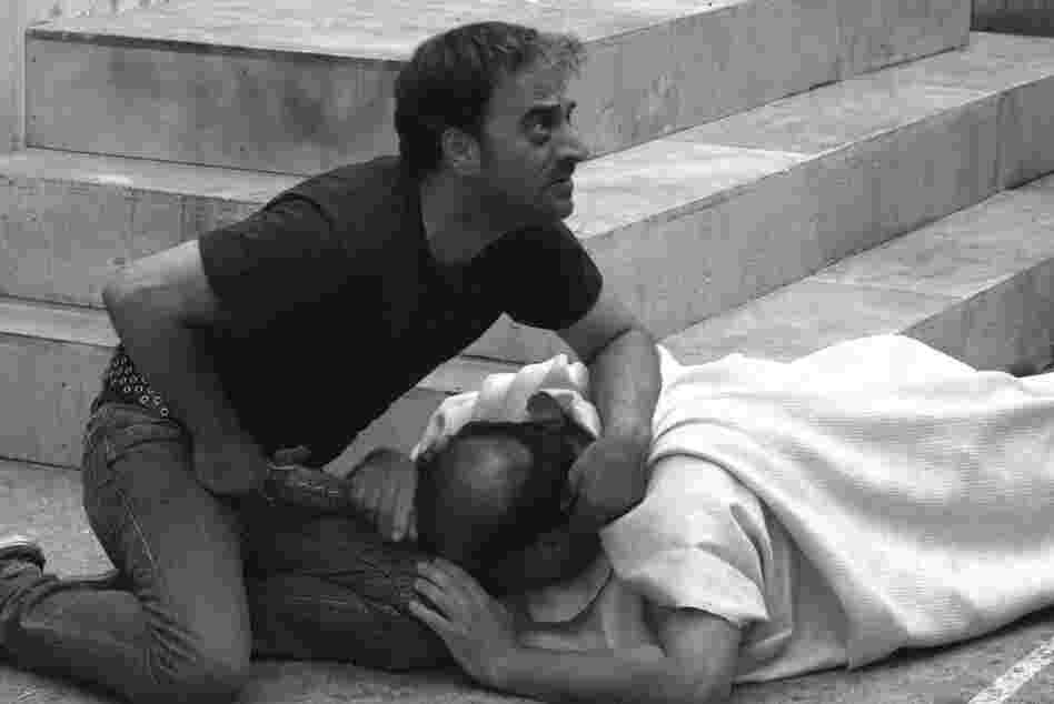 Brutus (Salvatore Striano) delivers the final blow to the dying Caesar (Giovanni Arcuri) during a performance of Shakespeare's Julius Caesar in the film Caesar Must Die.