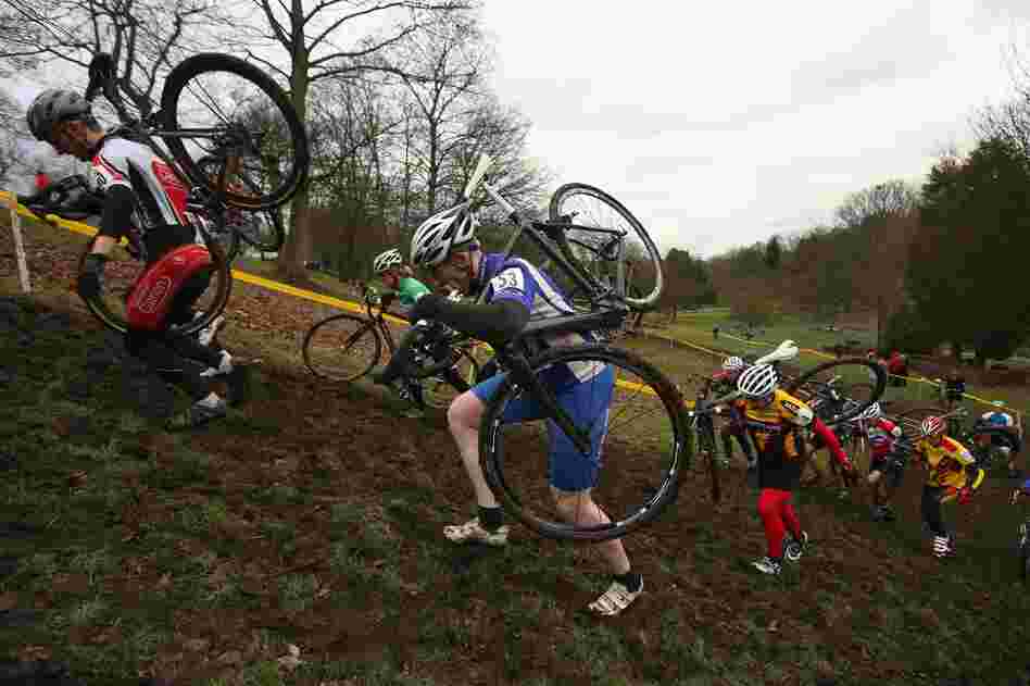 Competitors in a men's category race in the 2013 National Cyclo-cross Championships in Bradford, England, this month. The sport requires riders to traverse mud and sand on off-road courses peppered with obstacles.