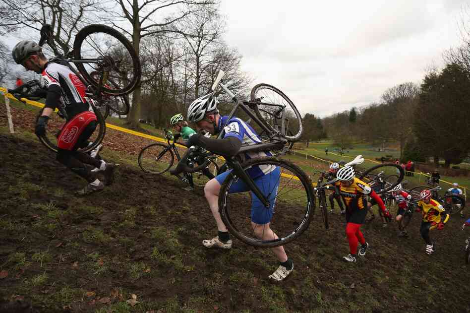 Competitors in a men's category race in the 2013 National Cyclo-cross Championships in Bradford, England, this month. The sport requires riders to traverse mud and sand on off-road courses peppered with obstacles.
