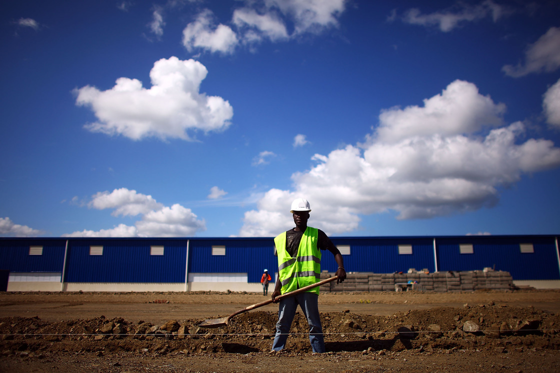 Workers prepare the foundation for a new warehouse and manufacturing facility at the Caracol Industrial Park in northern Haiti. The park, which opened last year, is still under construction.