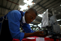 Workers at the SAE-A plant earn $5 a day. Critics say this is not enough to lift families out of poverty.