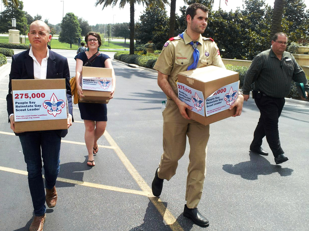Eagle Scout Zach Wahls delivers cartons of petitions to the Boys Scouts of America national board meeting in Orlando, Fla., last May, calling for an end to anti-gay discriminatory practices. Helping to carry the cartons are Mark Anthony Dingbaum and Christine Irvine of Change.org.