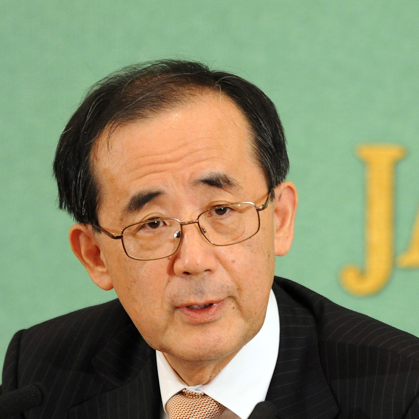 Bank of Japan (BOJ) Governor Masaaki Shirakawa speaks before the press in Tokyo on January 25, 2013. Shirakawa said that the two-percent target is hard to achieve because it needs various efforts including those by the government in reforms in regulations that could be politically difficult. AFP PHOTO / RIE ISHIIRIE ISHII/AFP/Getty Images