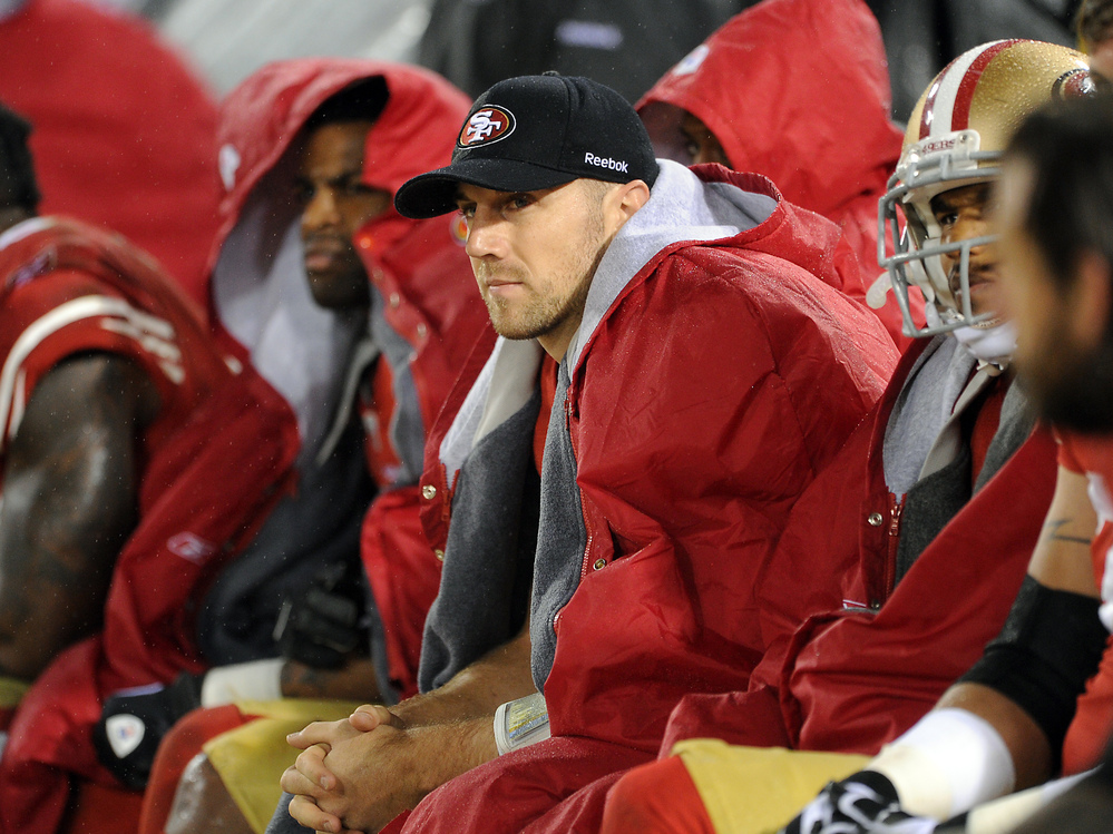 San Francisco 49ers quarterback Alex Smith looks on from the sidelines during the overtime period against the New York Giants on Jan. 22, 2012, in San Francisco.