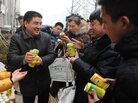 Chinese businessman Chen Guangbiao (center) gives cans of fresh air produced by his factory to passersby for free in a financial district in Beijing. Chinese businessman Chen Guangbiao (center) gives cans of fresh air produced by his factory to passersby for free in a financial district in Beijing.