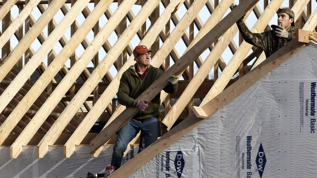A new home under construction in Pepper Pike, Ohio. This spring's jobs data could look much brighter if housing  heats up.