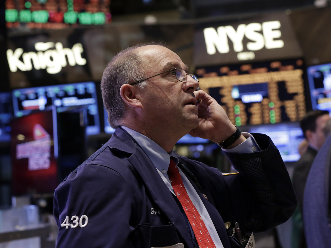 Trader Frederick Reimer works on the floor of the New York Stock Exchange on Friday.