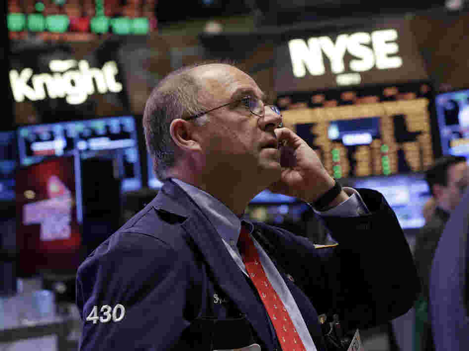 Trader Frederick Reimer works on the floor of the New York Stock Exchange on Friday.