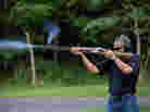 President Obama shoots clay targets on the range at Camp David in Maryland on Aug. 4.