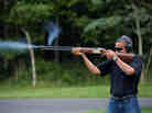 President Obama shoots clay targets on the range at Camp David in Maryland on Aug. 4.