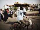 An Egyptian man delivering bread rides through Cairo's Tahrir Square last year. Couriers are taking great risks as they work around Egypt's capital. An Egyptian man delivering bread rides through Cairo's Tahrir Square last year. Couriers are taking great risks as they work around Egypt's capital.