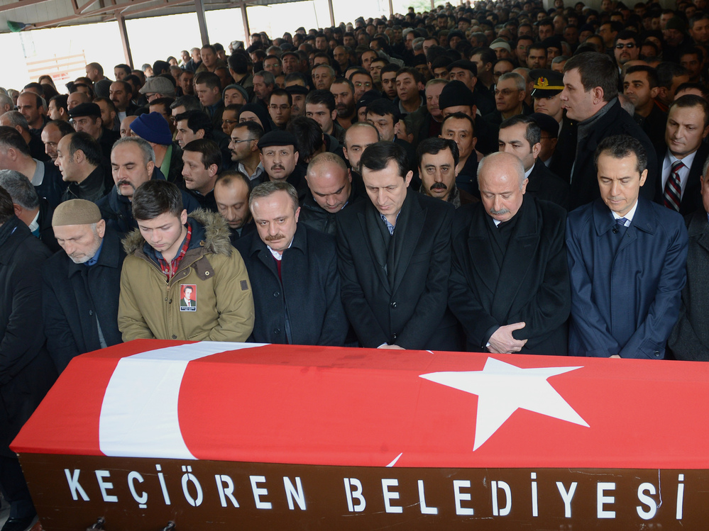 Mourners gather in Ankara on Saturday by the coffin of Mustafa Akarsu, who was killed in the attack on the U.S. Embassy in Turkey's capital on Friday.